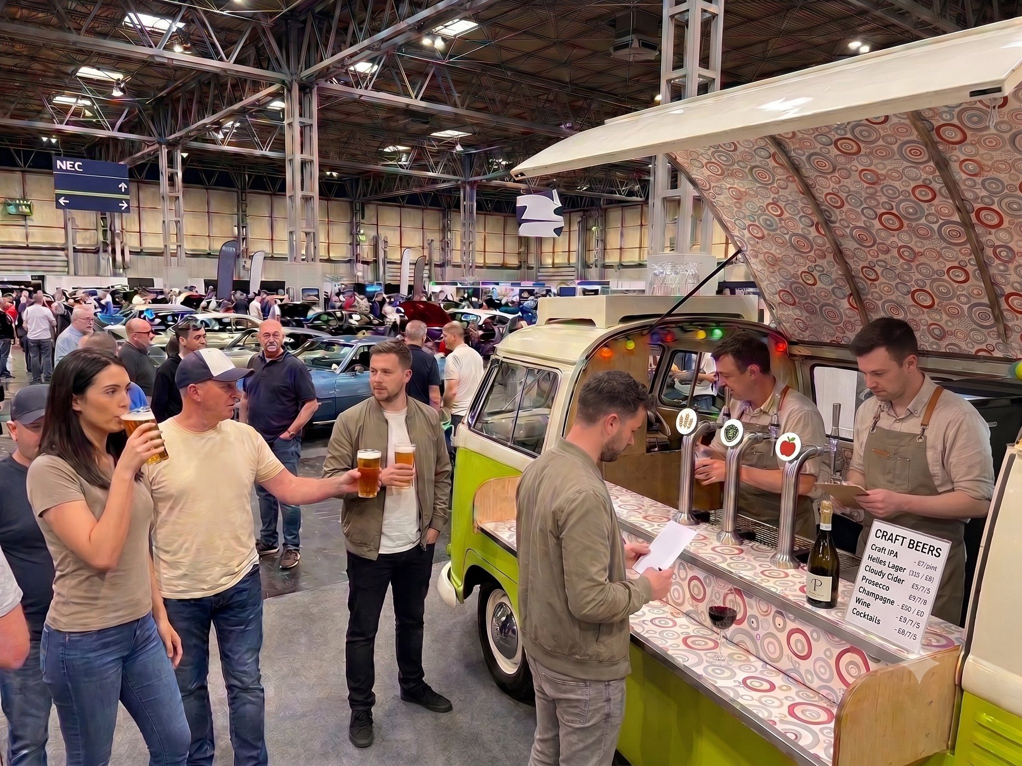 Harvey serving drinks at an indoor corporate event and trade fair